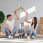 First-time homebuyers receiving keys to a new house with no down payment