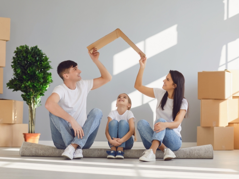 First-time homebuyers receiving keys to a new house with no down payment