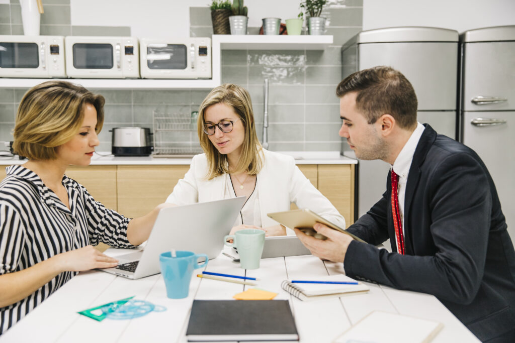 Real estate attorney discussing property documents during a free consultation with client.